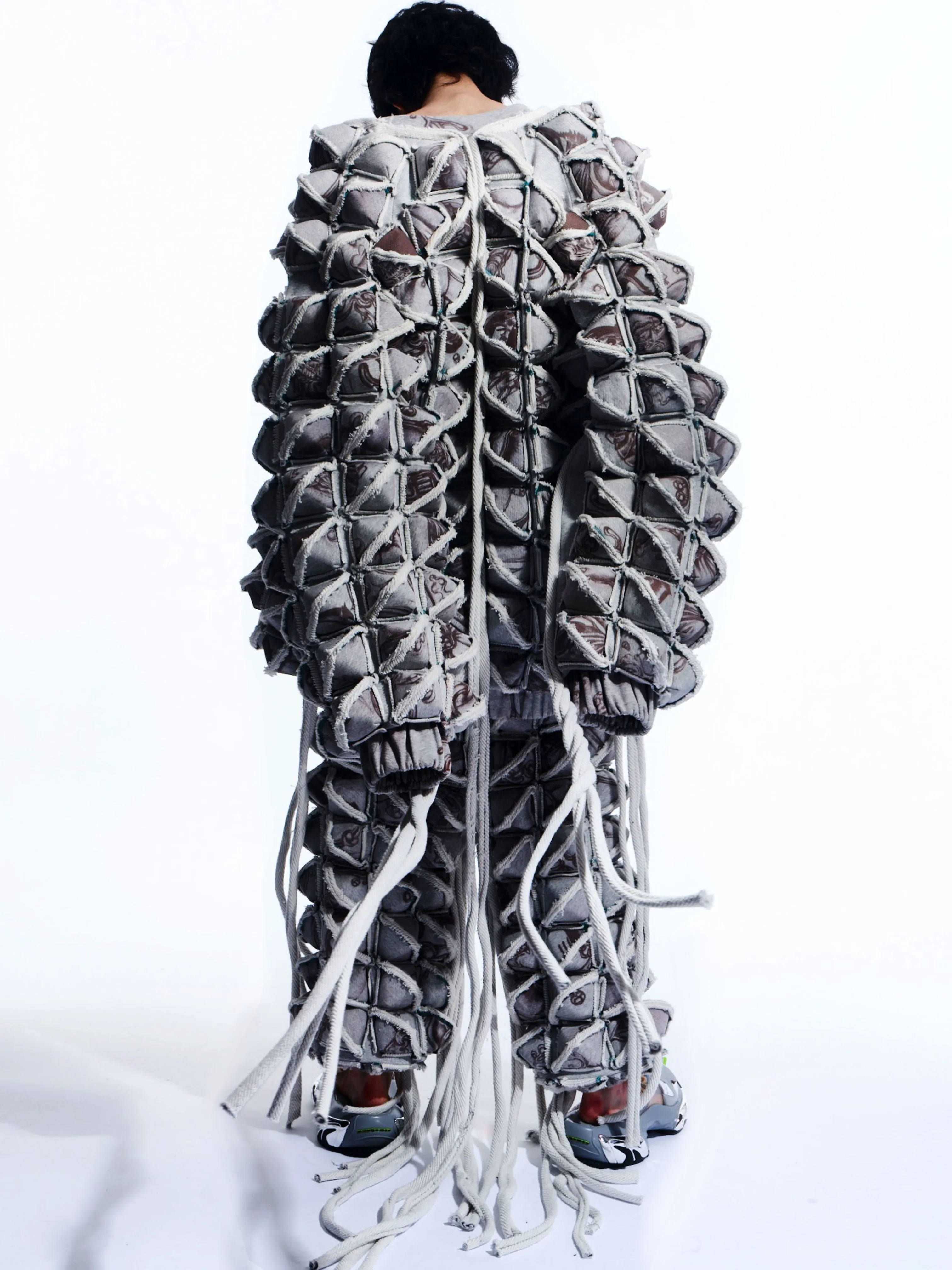 GRAPHIC SPIKED DEFENCE COAT WITH FRINGING